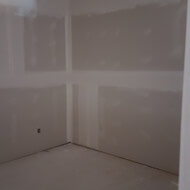 Drywall going up and taping being done in suites.