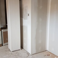 Drywall going up and taping being done in suites.