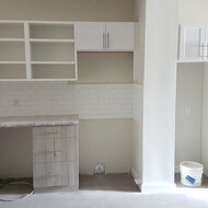 Tiling being completed.