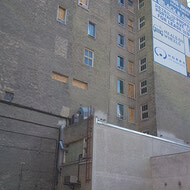 West side of building. Still a lot of masonry and window work to do.