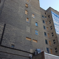 West side of building. Still a lot of masonry and window work to do.