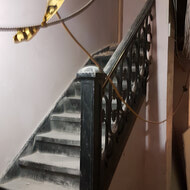 The old staircase with original iron spindles.